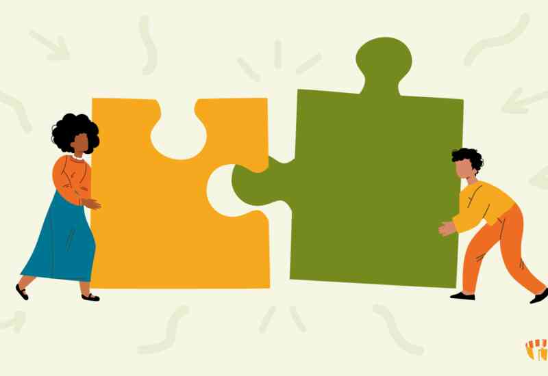 An illustrated image of two figures connecting two large puzzle pieces.