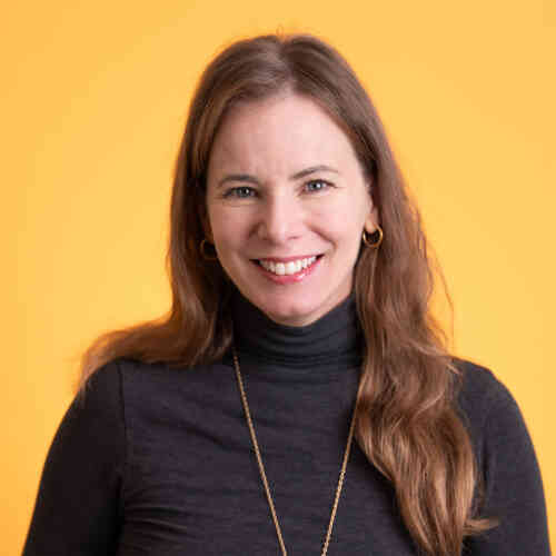 A headshot of Michelle Francois against a bright yellow backdrop.